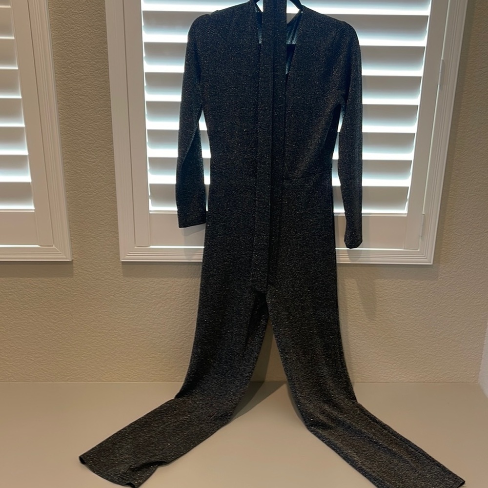 Get ready for a night out with this black and silver sparkle jumpsuit